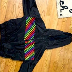 Black jacket with rainbow stripe.